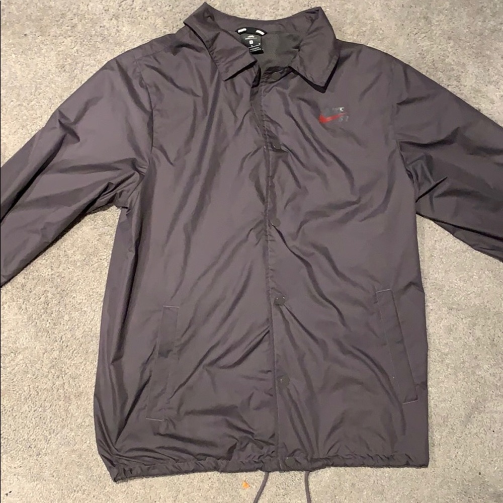 Nike sports jacket w/ collar. Also buttons up.